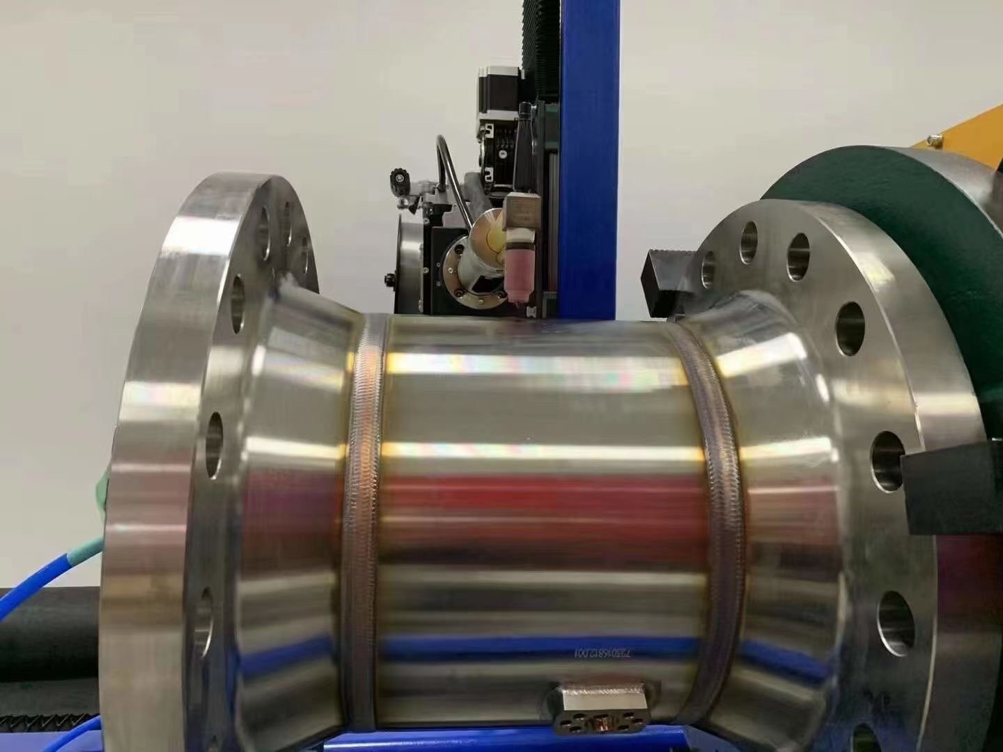 Automated welding of flow meter pipe to flange