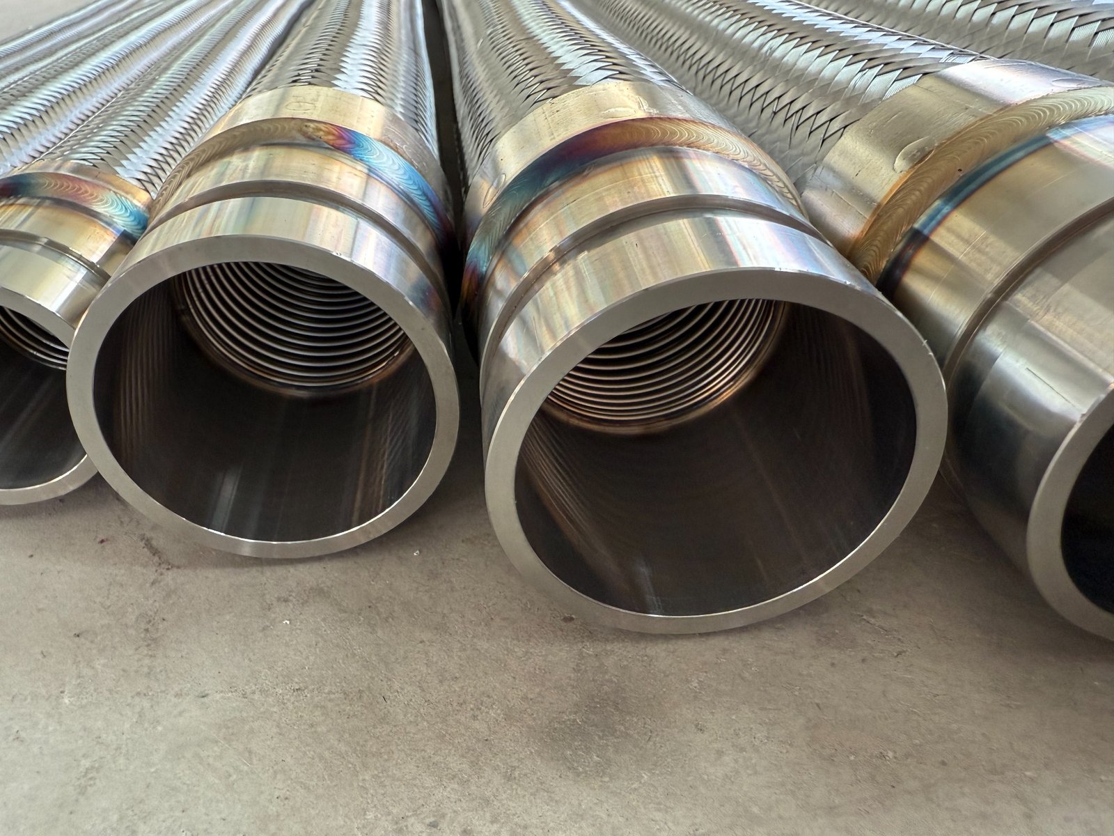 Corrugation flattening process before automatic metal hose welding