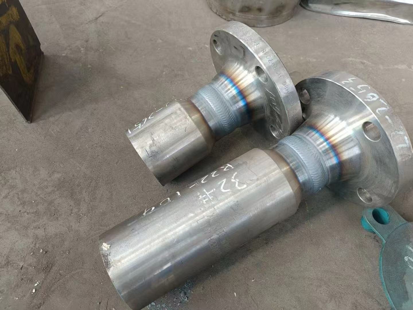 Automated pipe to flange welding for magnetic level gauges