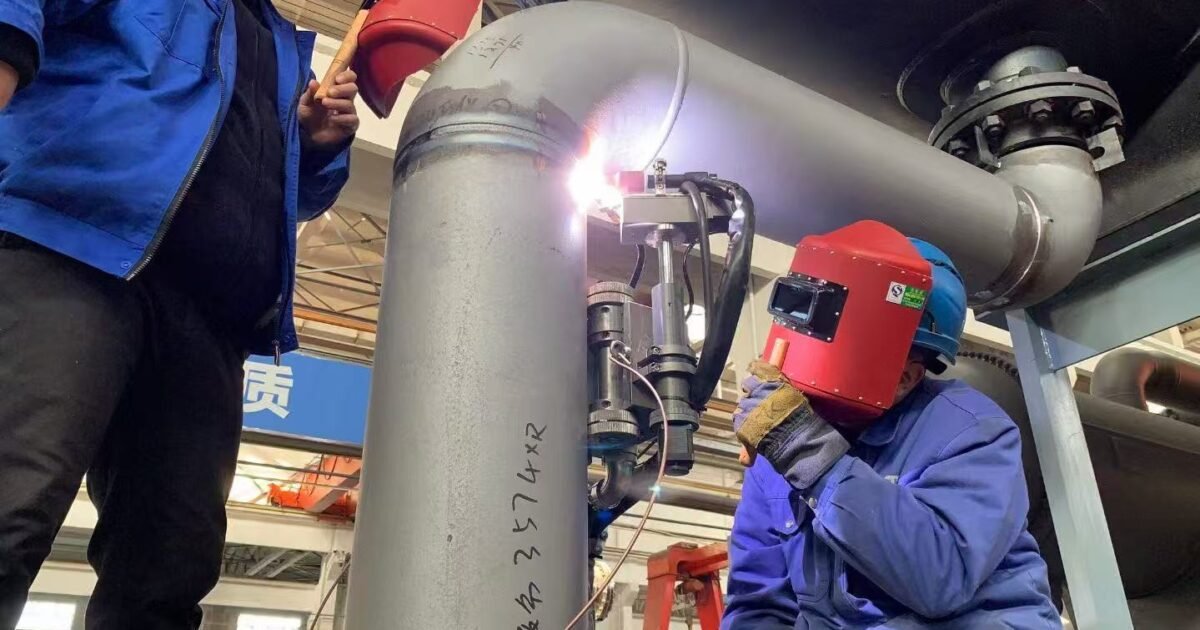 Automatic TIG welding system operating on pressure piping for industrial pipe manufacturing and welding automation