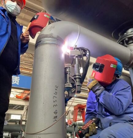 Automatic TIG welding system operating on pressure piping for industrial pipe manufacturing and welding automation