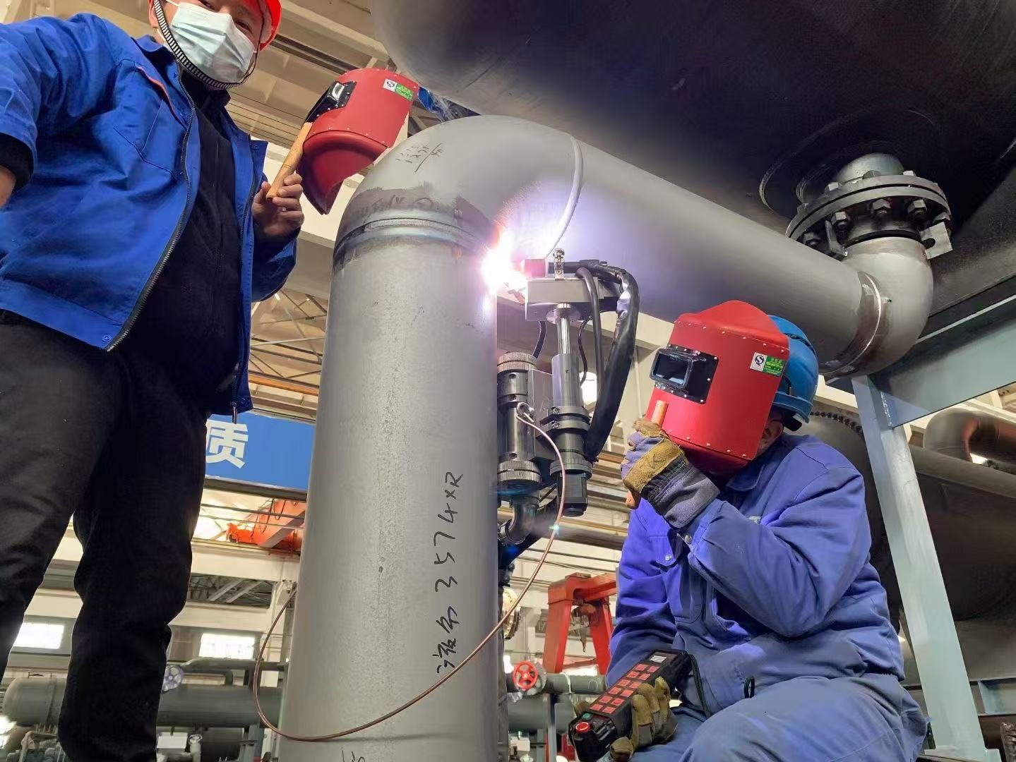 Automatic TIG welding system operating on pressure piping for industrial pipe manufacturing and welding automation