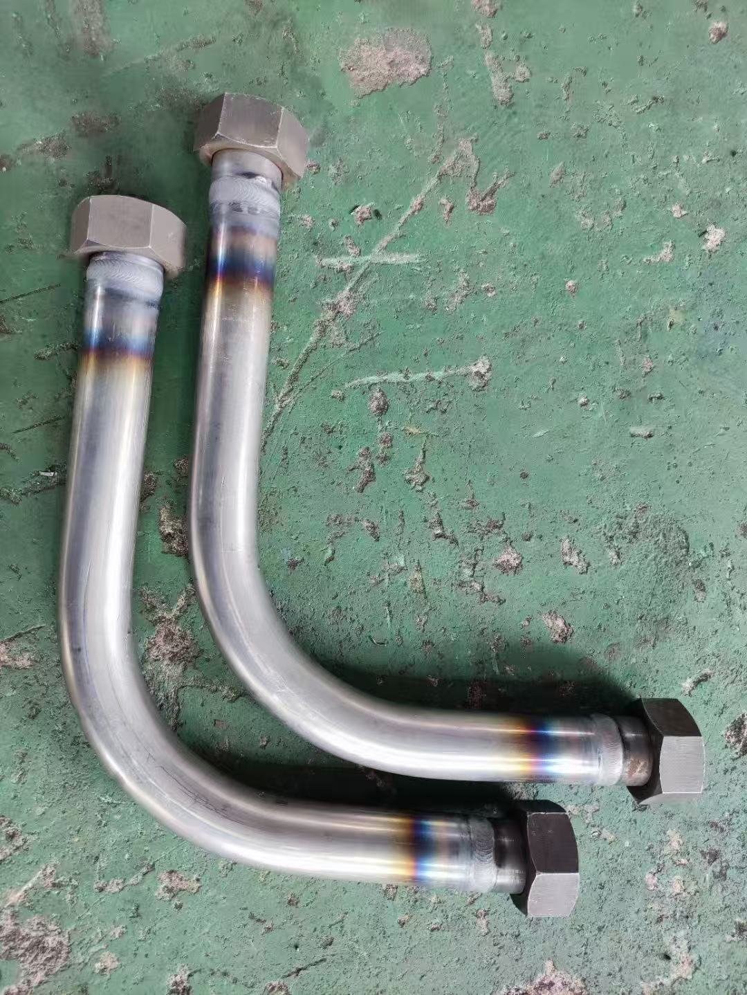 Bent hydraulic tubes with welded end fittings after automatic TIG welding