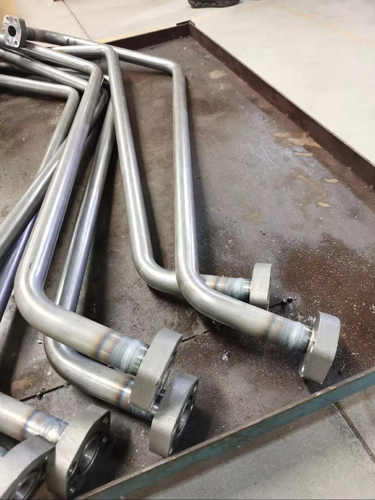 Rotary torch TIG welding a tube fitting in process
