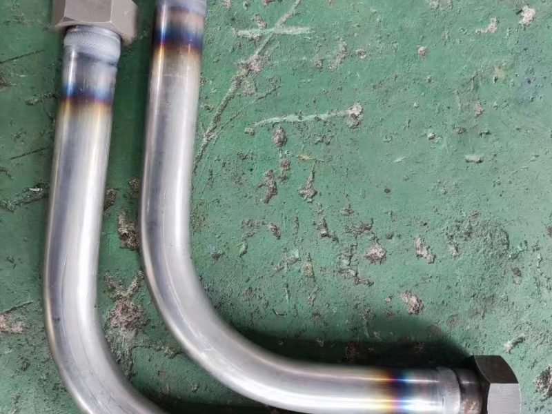 Bent hydraulic tubes with welded end fittings after automatic TIG welding