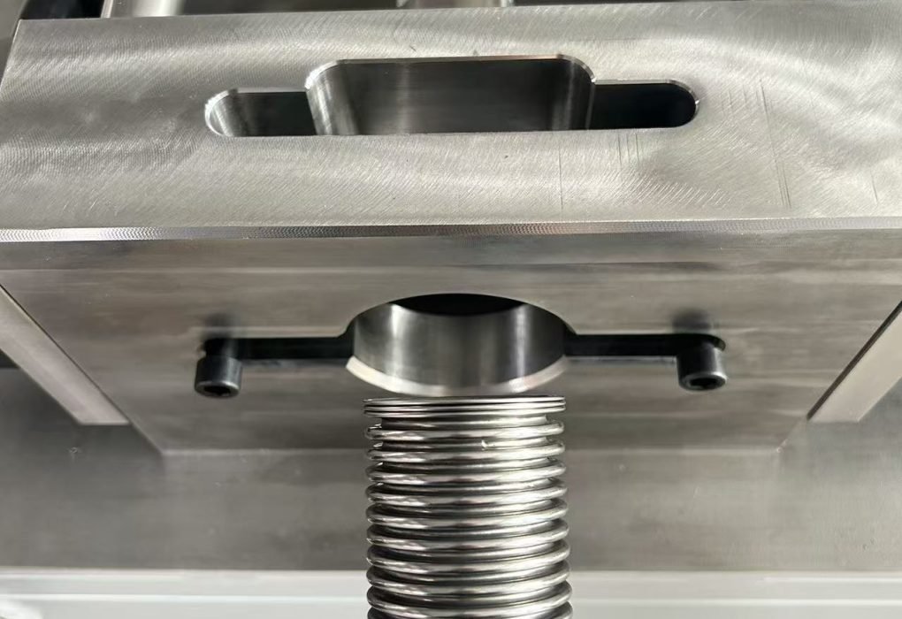 Corrugation flattening process before automatic metal hose welding