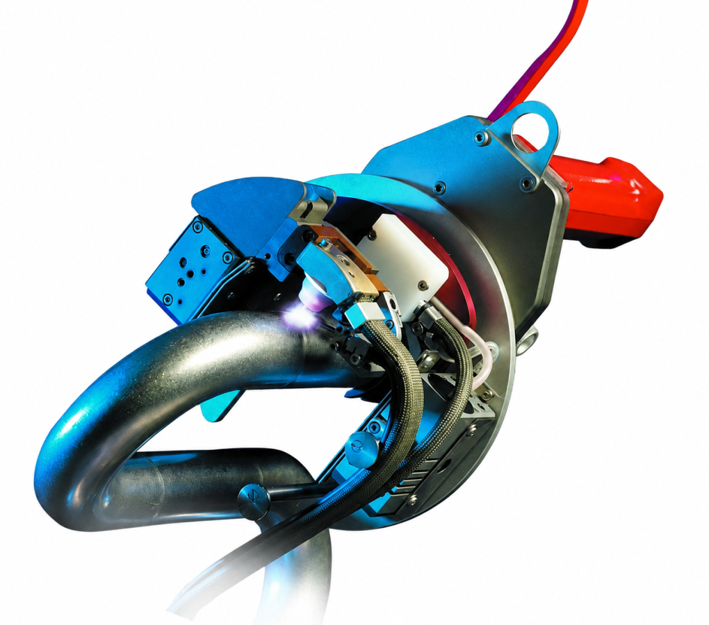 Open orbital TIG welding head positioned on a curved pipe