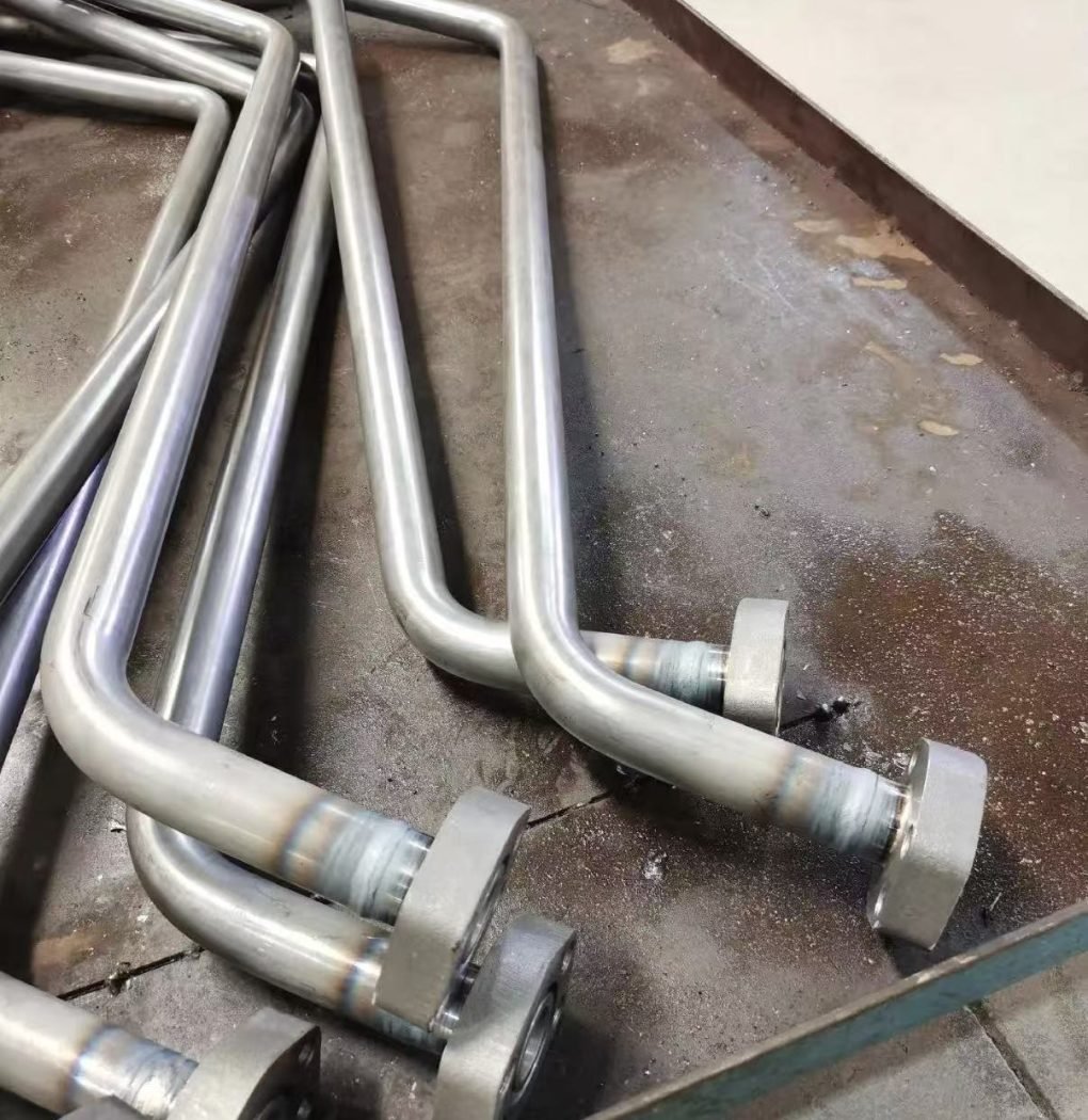 Rotary torch TIG welding a tube fitting in process