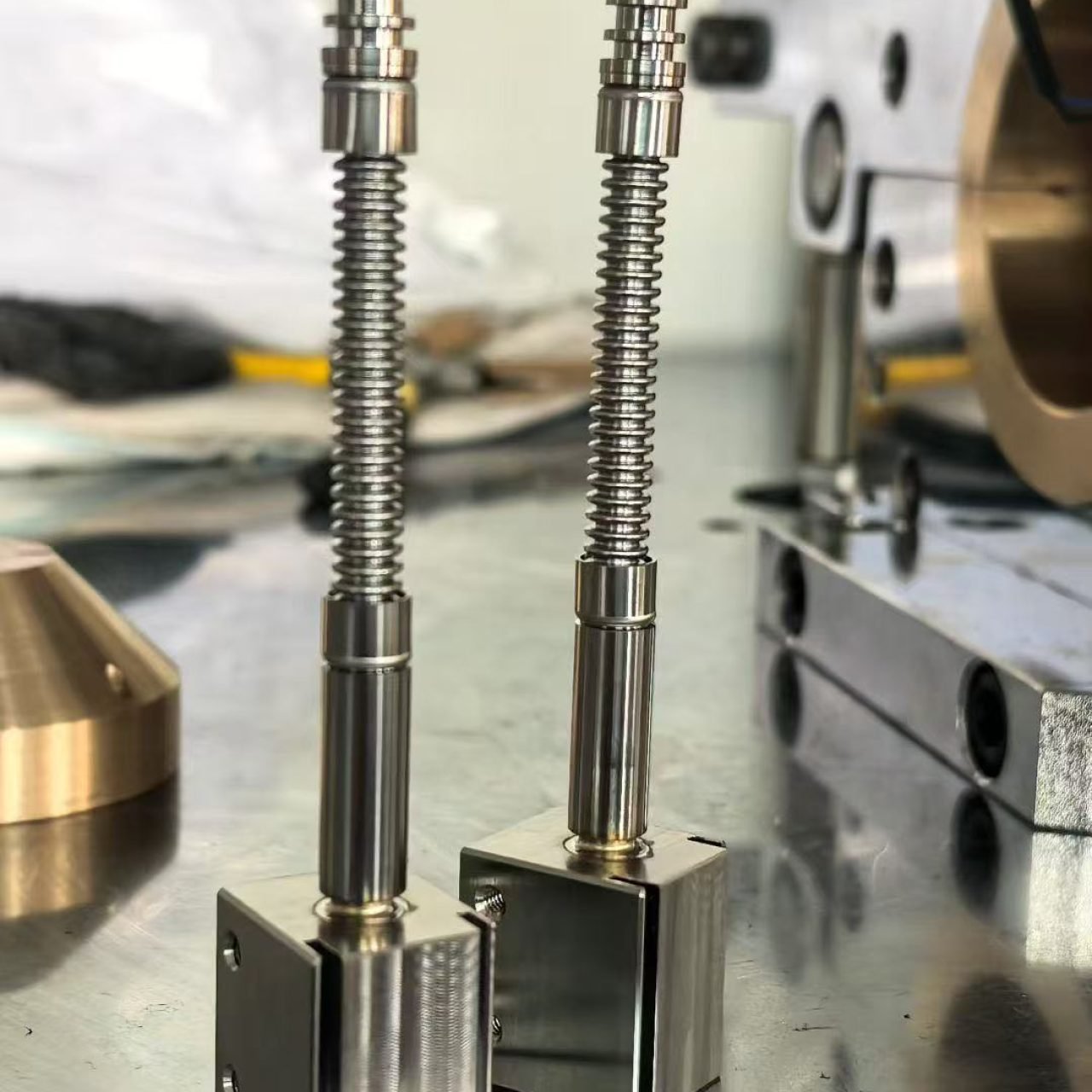 Small-diameter corrugated stainless steel hoses welded to precision fittings for liquid cooling applications.
