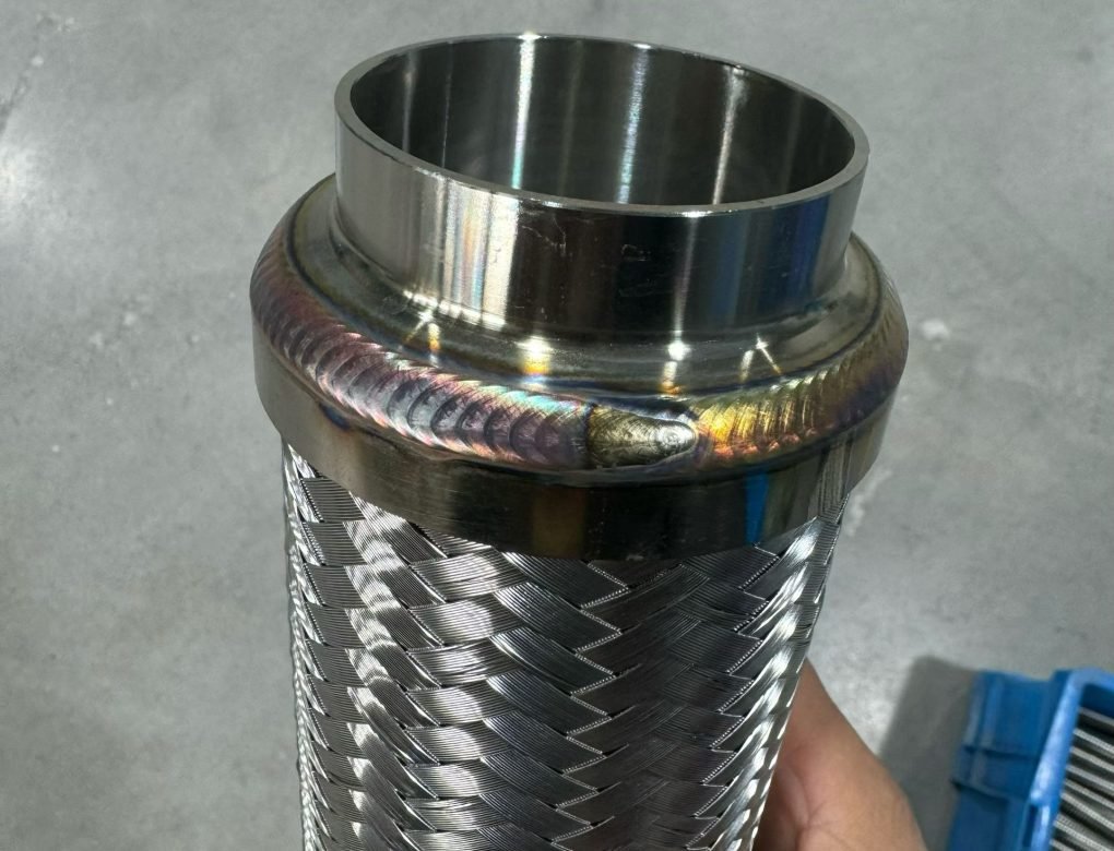 TIG weld bead on stainless steel braided hose fitting after automatic metal hose welding