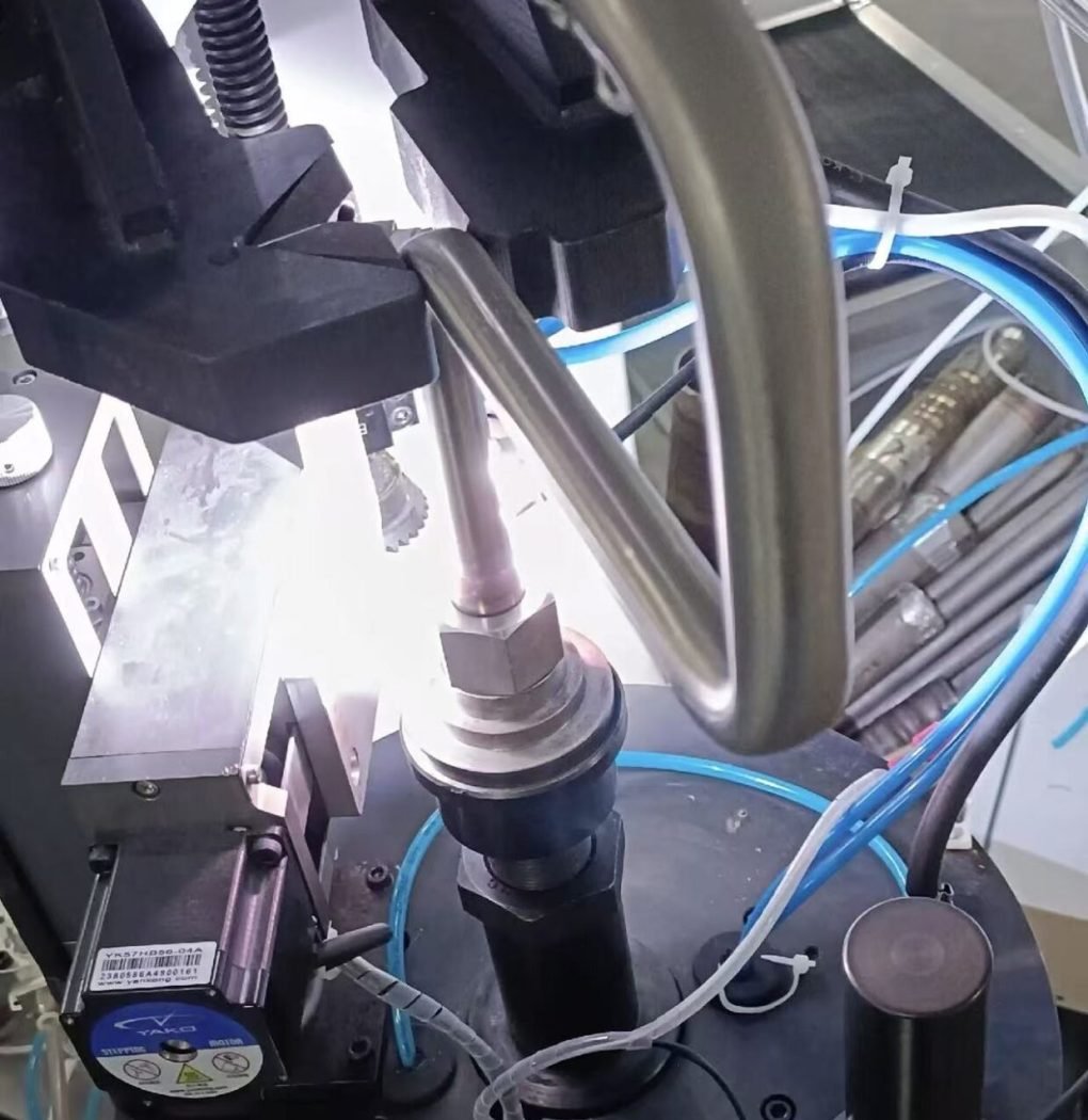 Vertical rotary torch TIG welding machine for tube fittings