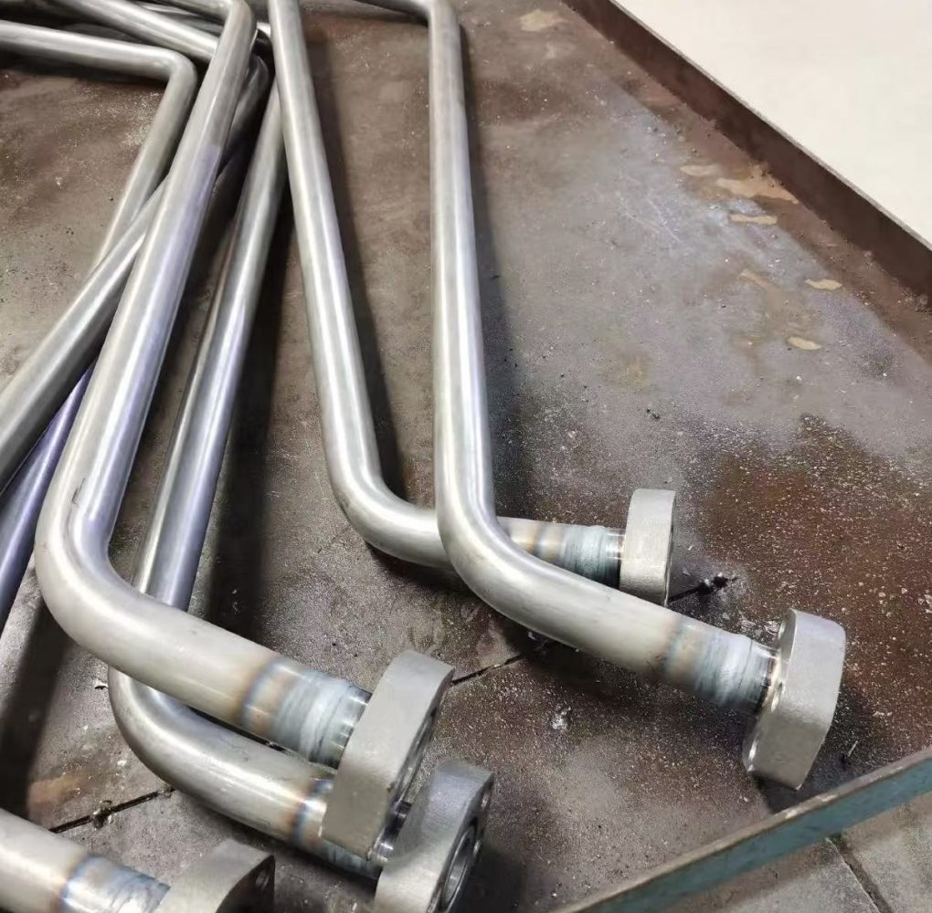 Vertical Rotary Torch Welding for bent tube and flange assemblies