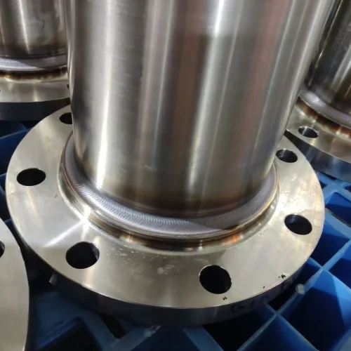 Welded pipe-to-flange joint close-up